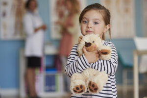 little girl with doctor at pediatric urgent care tulsa, oklahoma